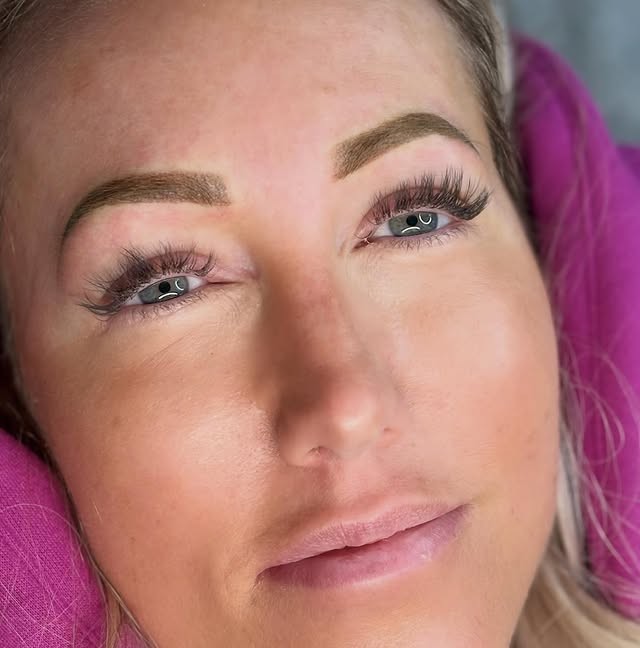 Client with lash extensions, defined brows and soft lip colour by Emily's Beauty, West Kelowna